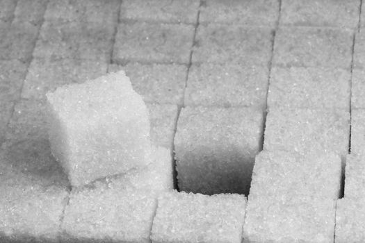 Cubes of sugar on black bacground