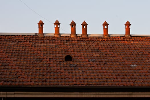 Six chimneys on tiles roof