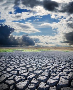 view to dry lake and dramatic sky over it