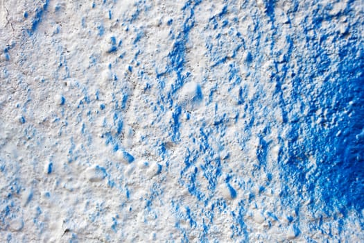 Blue color on a white wall