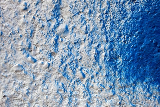 Blue color on a white wall