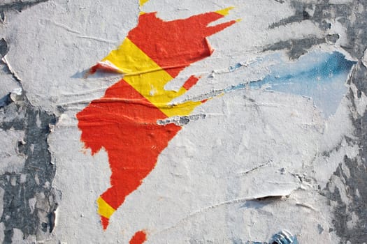 Torn posters on a iron surface