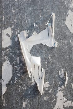 Torn posters on a iron surface