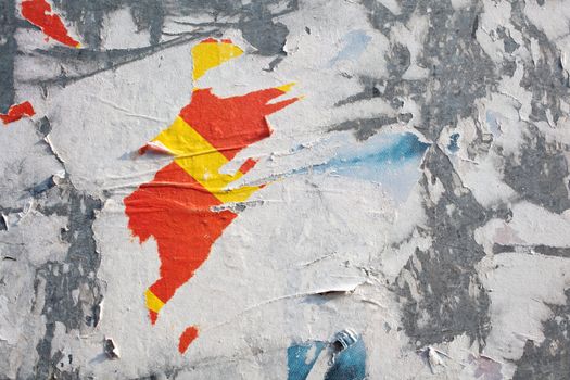 Torn posters on a iron surface