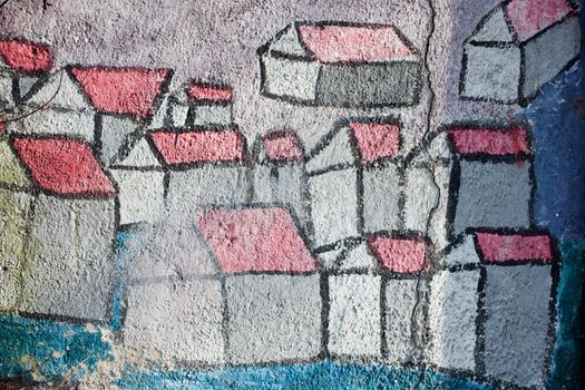 Graffiti, stylized houses painted on the wall
