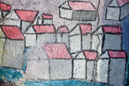 Graffiti, stylized houses painted on the wall