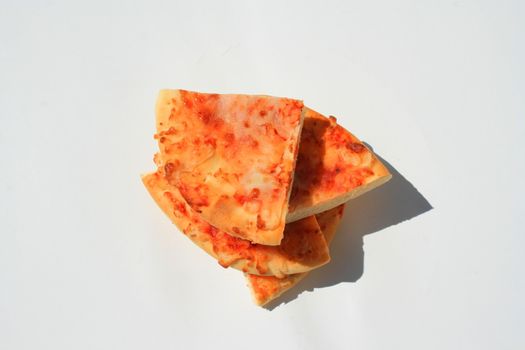 Close up of a mini cheese pizza slices.
