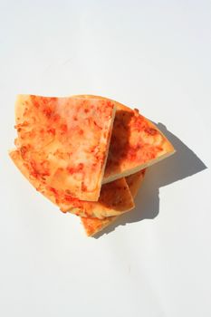 Close up of a mini cheese pizza slices.
