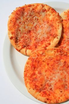 Close up of the mini cheese pizzas.
