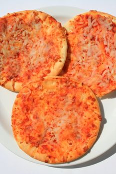 Close up of the mini cheese pizzas.
