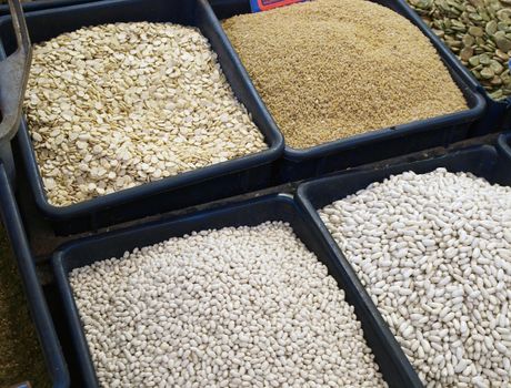 Market display of different dried legumes, beans and rice     