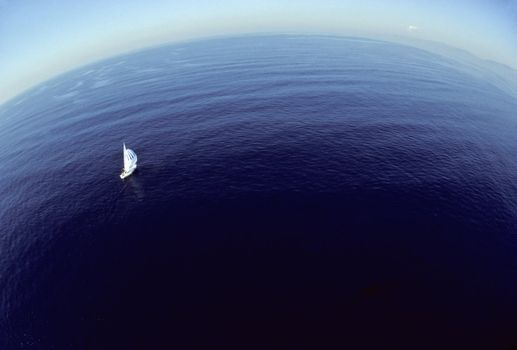 Bird's eye view of a sailboat and the infinite horizon