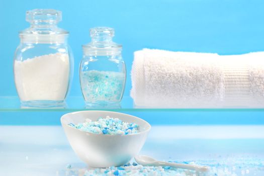 Blue bath salts with towel for relaxing bath