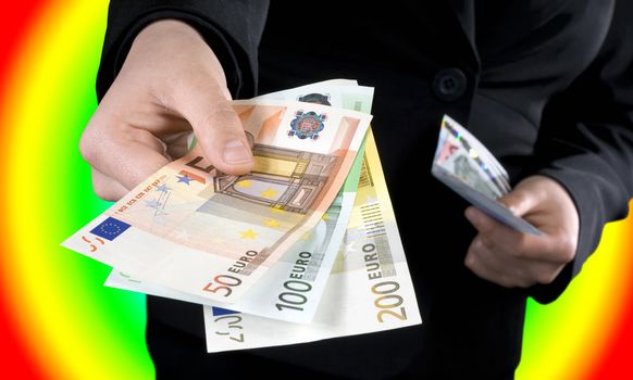 Hand giving Euro banknotes of 50, 100 and 200 Euro with another hand in the background keeping the spare. Colorful casino background.

Studio shot.