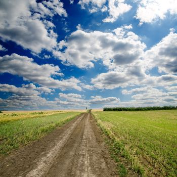 rural road under dramatic sky