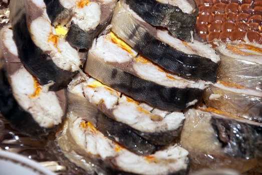 Fresh tasty fish dish cut into wedges