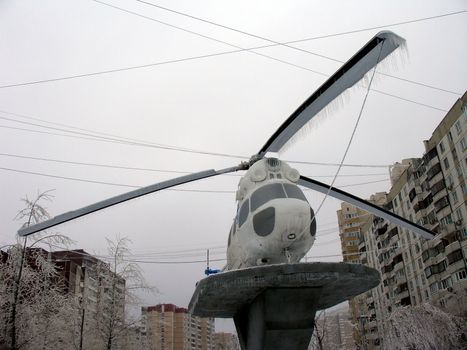 Helicopter wholly in ice with icicles after winter storm