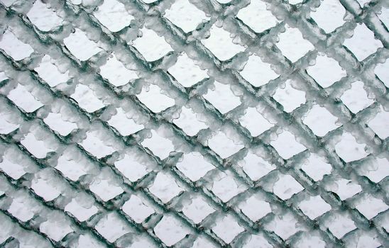 Lattice fence wholly in ice after winter storm
