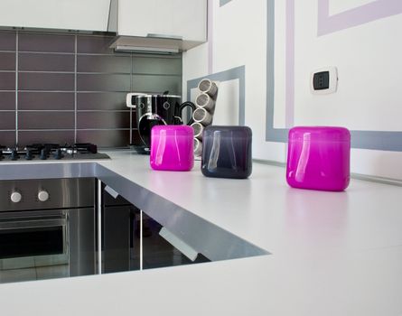 Fuchsia Plastic bowls on white kitchen