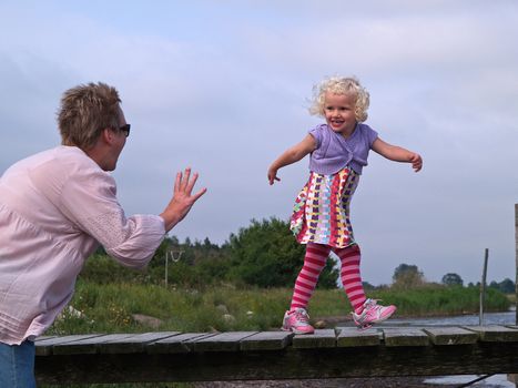 Young girl and grandmother play and have fun together