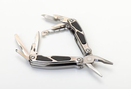 Steel pliers folding multi tool opened on white background