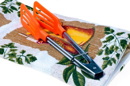 pliers to turn the omelet and tea towel