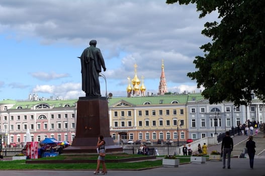 Moscow, Russia - June 14, 2010: Summer day. Peoples walk near the Monument of Artist Repin on June 14, 2010 in Bolotnaya square, Moscow, Russia