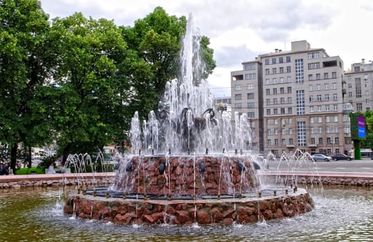 Moscow, Russia - June 14, 2010: Summer day. Peoples walk near the Fountain on June 14, 2010 in Bolotnaya square, Moscow, Russia