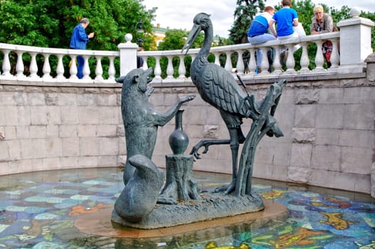 Moscow, Russia - June 14, 2010: Summer day. Peoples walk near the Fountain Russian tales on June 14, 2010 in Ohotniy ryad, Moscow, Russia