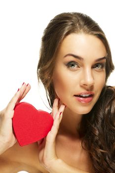 beautiful woman presenting red heart on white background