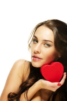 beautiful woman holding small red heart on white background