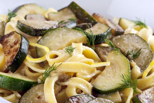 Vegetarian pasat with zucchini and dill lemon sauce.
