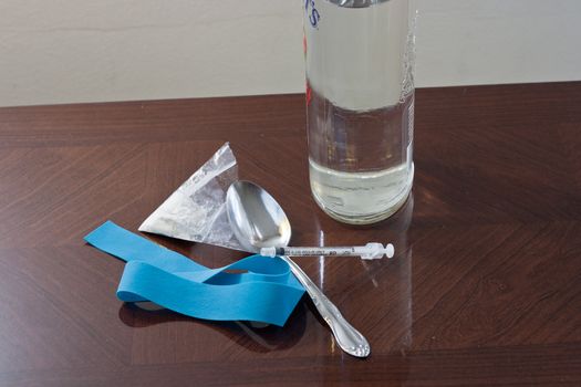 White Powder Drug Ready to be used with liquor bottle.