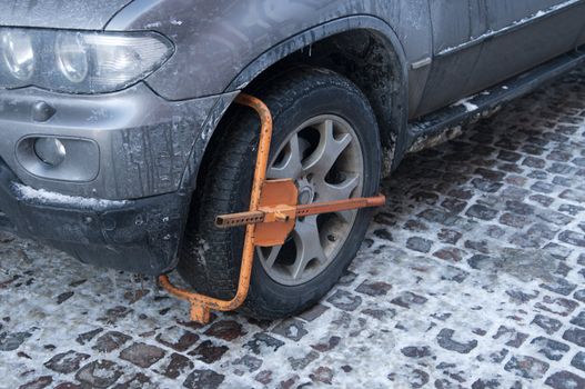 Car with a wheel block for illegal parking.