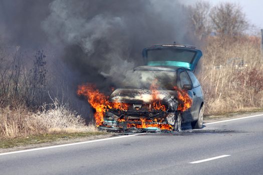 burning car on the road