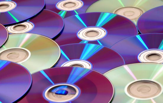 background full of CDs and DVDs