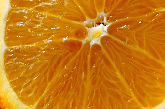 Juicy yellow orange in the context of a close-up