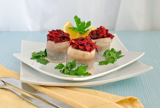 Herring fillet stuffed with beet-apple stuffing with herbs