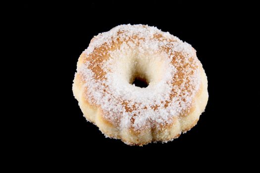 donut home sugar made with butter sugar flour and eggs isolated on a black background