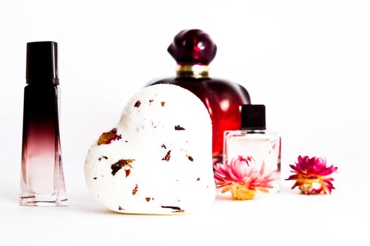 perfume with air-dried flowers on white