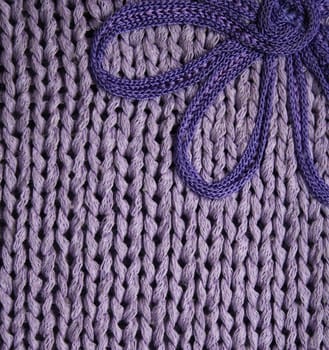Lilac knitted fabric with flower can use as background