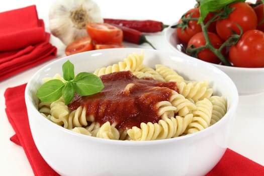 cooked pasta with tomato sauce and basil