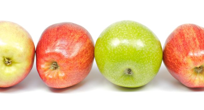 Four delicious apples on white background