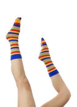 Close-up photo of the naked active legs in colored hosiery