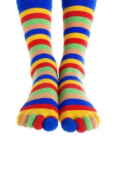 Close-up photo of two foots in the clown stockings
