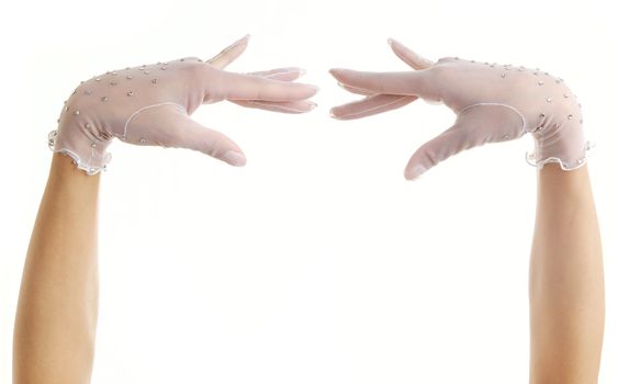 Close-up photo of two hands of dancer in white gloves