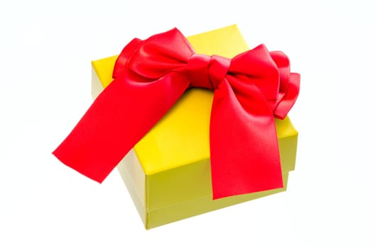 Gift box with a red ribbon bow isolated on white background.