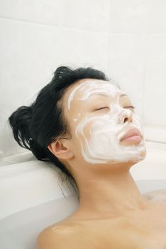 Sleeping woman with beauty mask in spa saloon