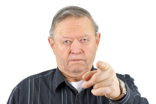 Portrait of old senior man pointing at camera looking angry.