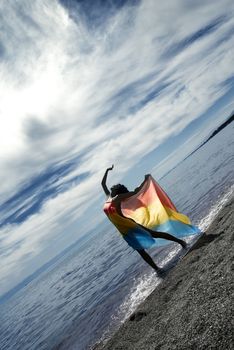 Lady making relaxation via the dance on a sea